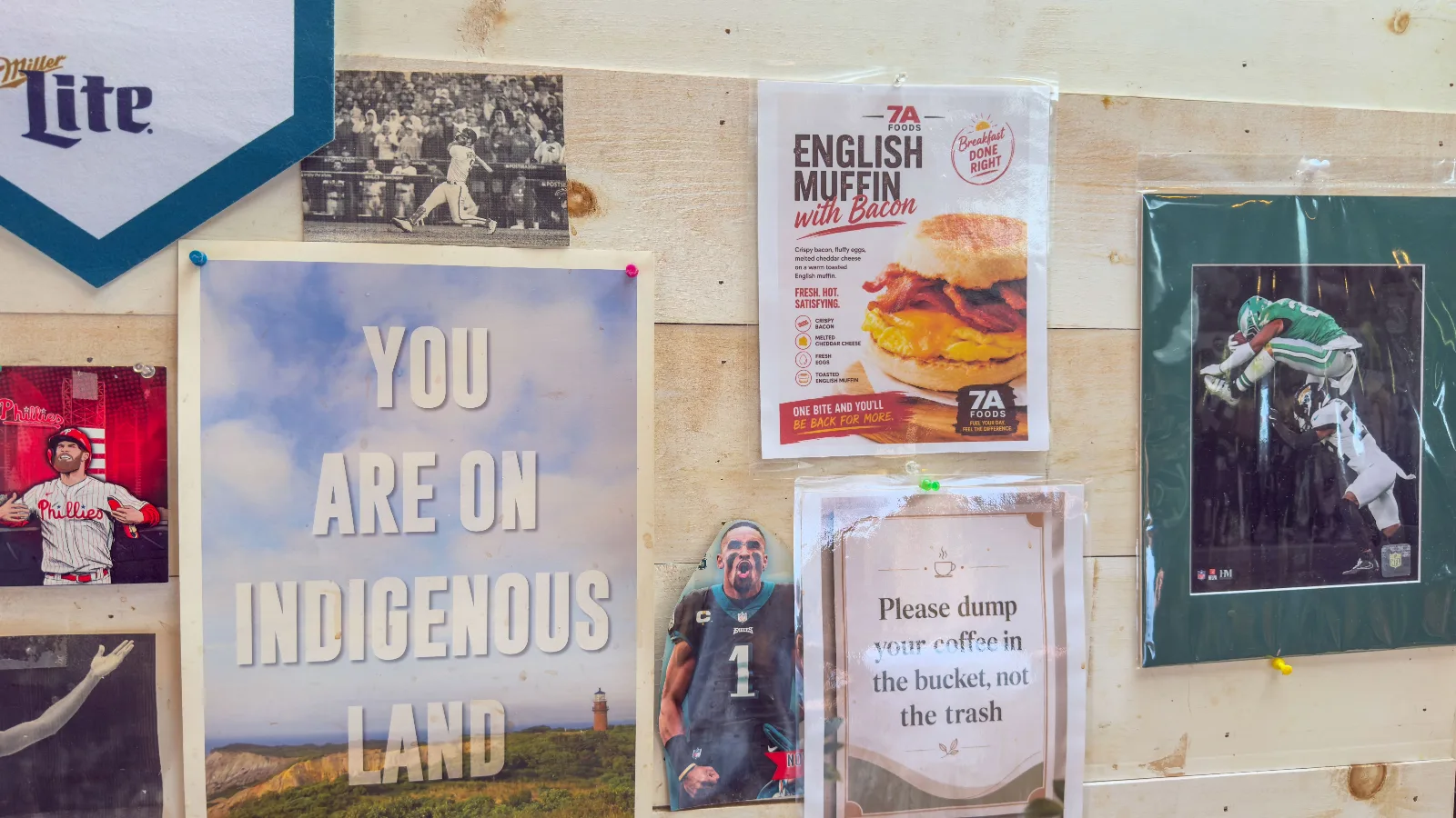 Noticeboard at 7a Foods: Phillies and Eagles clippings, an Aquinnah poster, house notices