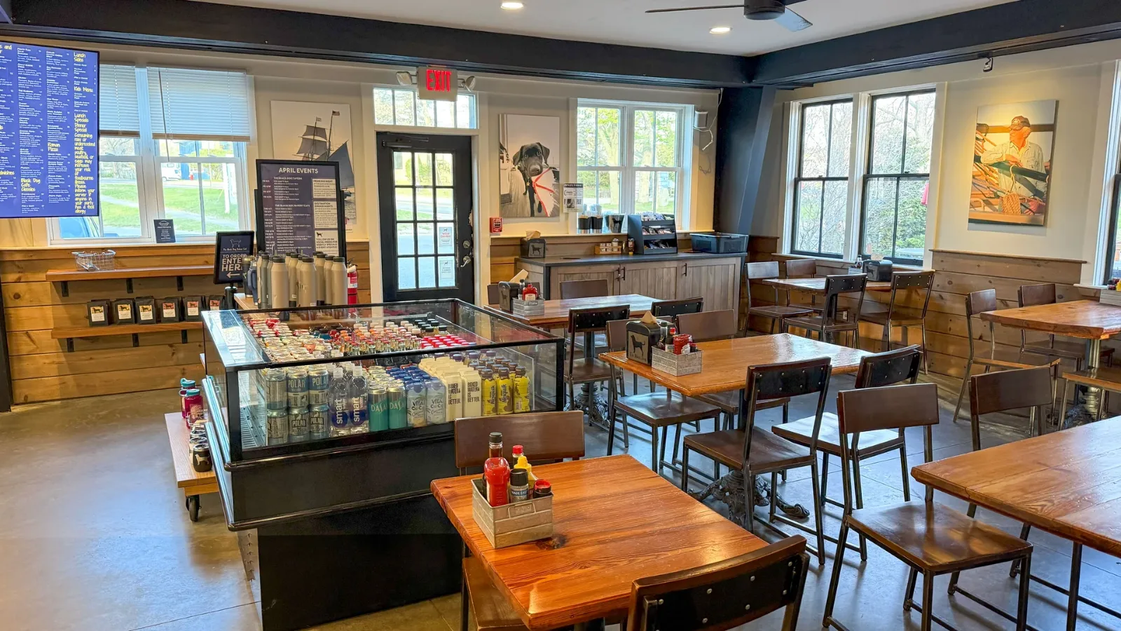 Inside the Black Dog Bakery Cafe on State Road, the counter and menu boards with the room laid out behind