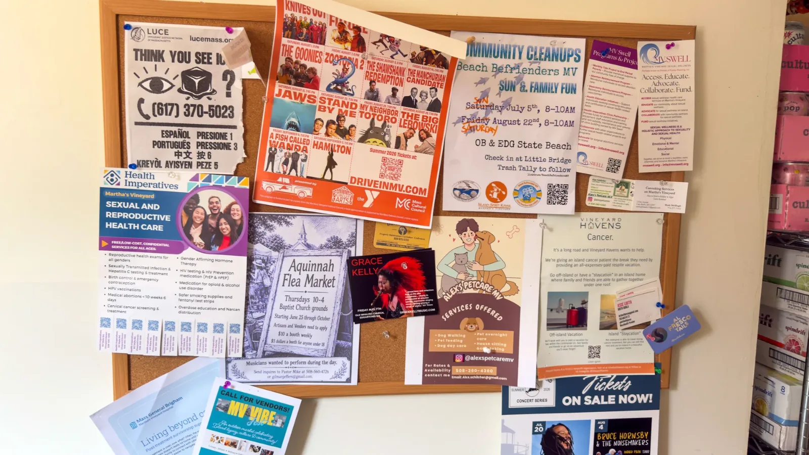 The community notice board at Mo's Lunch, layered with island posters and flyers