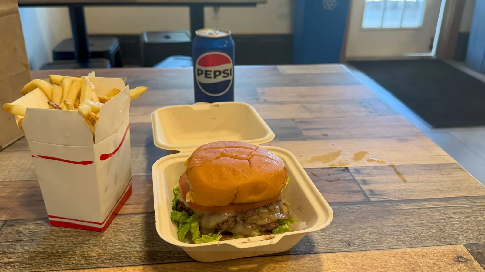 Cheeseburger and fries on the counter at Wicked Burger, Edgartown